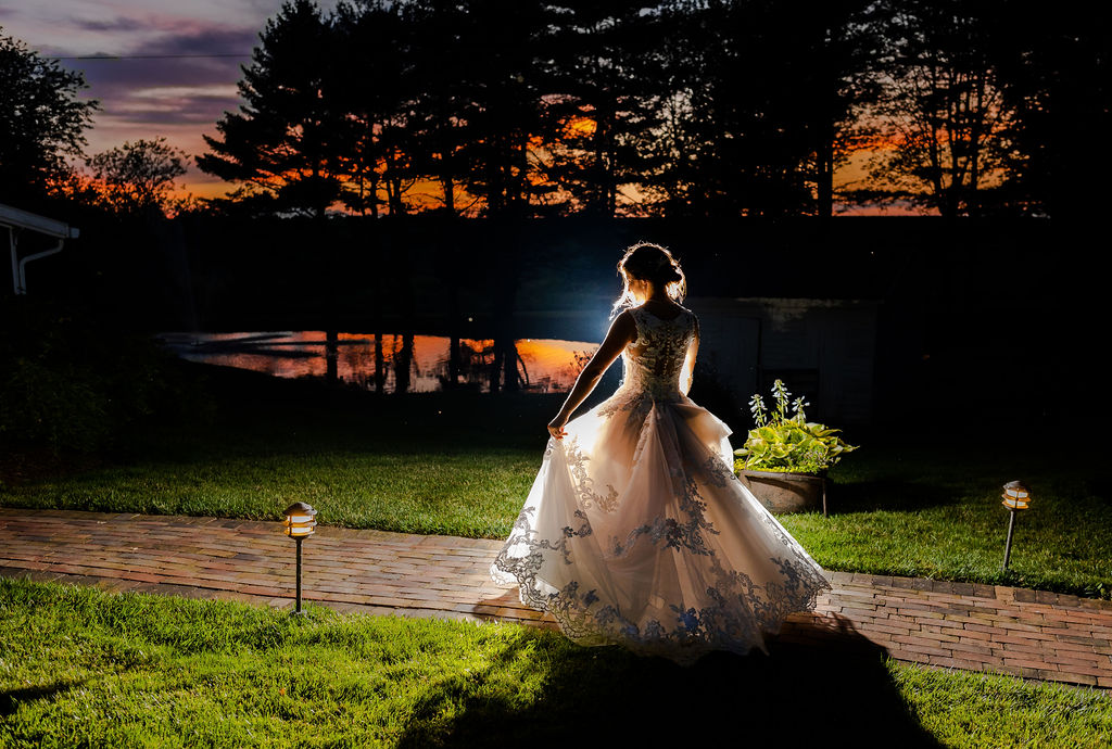 Night shot of bride twirling in dress at Christian Royer House, Maryland wedding photographer styles