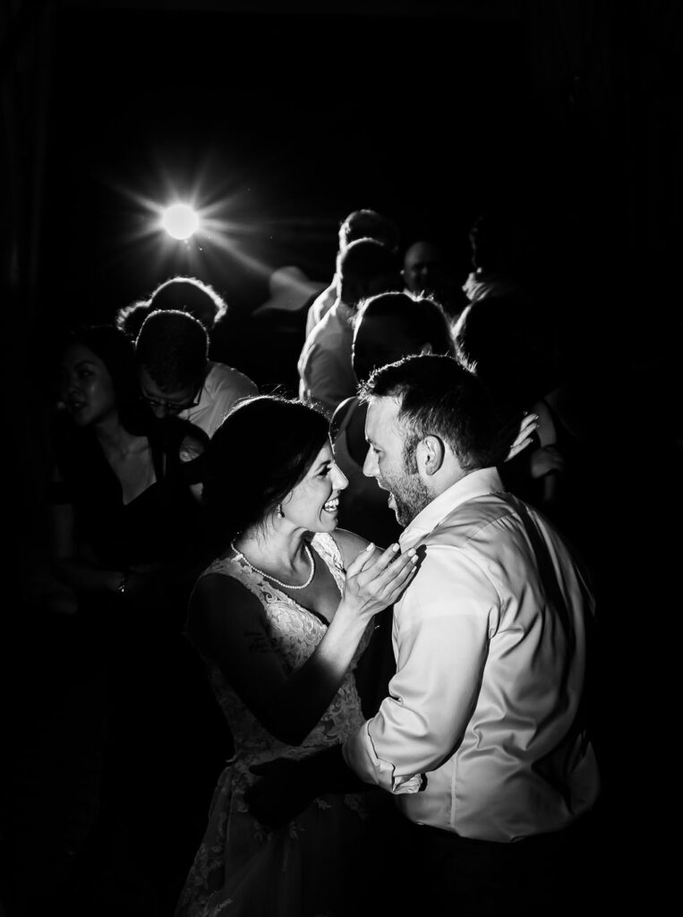 black and white photo of dancing bride and groom, Maryland wedding photographer styles